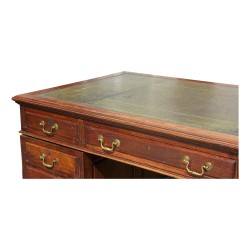 Bureau anglais en acajou, neuf tiroirs. Vers 1920.