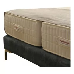 Handmade bed runner in beige.