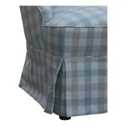 A seat covered in checked fabric