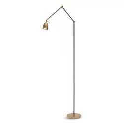 Reading light made entirely of brass. Two butterfly screw joints and a tilting head.