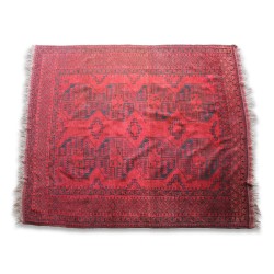 Afghan rug made of red wool.