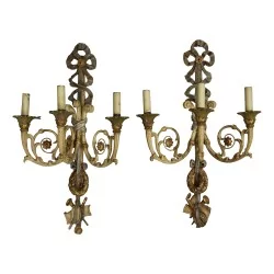 Pair of wall sconces in carved wood and metal. Italy.