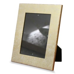 Gold lacquered photo frame with white pebble design.