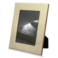 Gold lacquered photo frame with white pebble design.