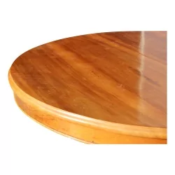 Round walnut table with two extensions. Vaudoise.