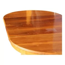 Round walnut table with two extensions. Vaudoise.
