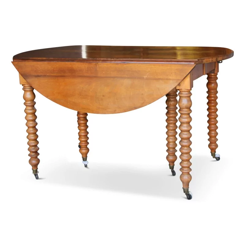 Drop-leaf table in walnut, turned legs with casters, 4 extensions. - Moinat - Dining tables