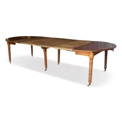 Drop-leaf table in walnut, turned legs with casters, 4 extensions.