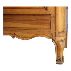 A richly molded walnut cabinet.