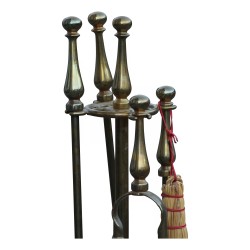Sets of bronze and wrought iron fireplace tools.