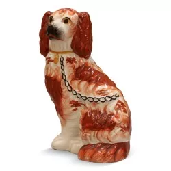 Chien "Staffordshire" en porcelaine, coloris rouge, blanc et noir.