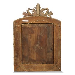 Miroir régence à parecloses en bois doré.