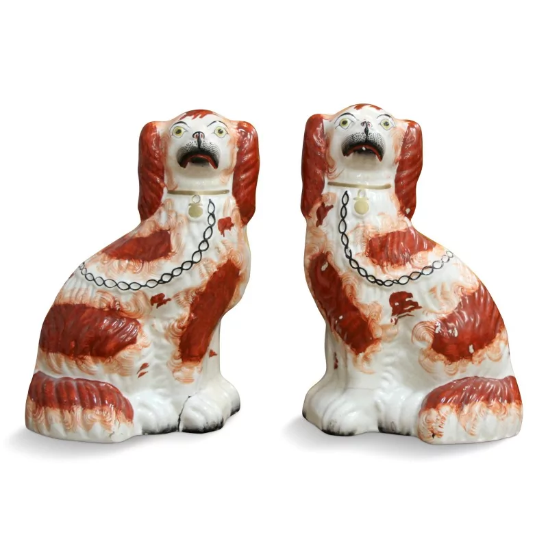 Ein Paar Porzellanhunde der Serie "Staffordshire" in den Farben Rot, Weiß und Schwarz. - Moinat - Porzellan