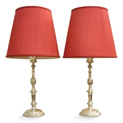 Pair of "Torch" lamps in silvered bronze with red silky lampshades.