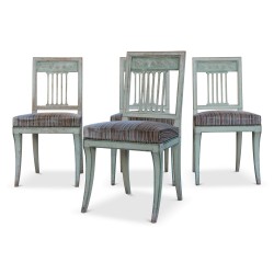Lot de quatre chaises directoire en bois peint, pieds sabre. Vers 1810