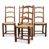 Lot de quatre chaises paillées Louis XIII en noyer Suisse. - Moinat - Chaises