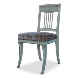 Lot de quatre chaises directoire en bois peint, pieds sabre. Vers 1810