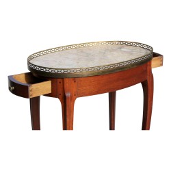 Chevet ovale en acajou "Maiffert-Amos" , plateau marbre avec galerie bronze.