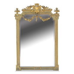Miroir Louis XVI en bois doré décor frises de godrons et perles