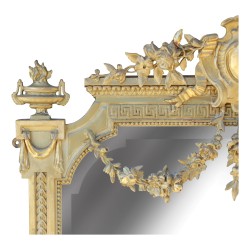 Miroir Louis XVI en bois doré décor frises de godrons et perles