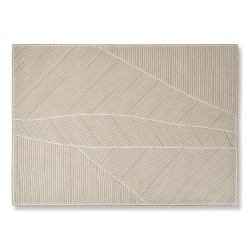Tapis "Zen Craie" avec 58 % de laine et 42 % de fibre synthétique.