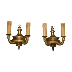 Paire d'appliques en bronze “Personnages”.