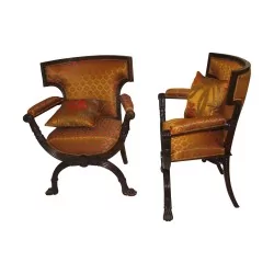 Pair of English armchairs in carved mahogany with X legs.
