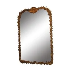 Carved and gilded wooden mirror.
