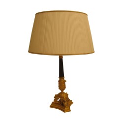 chiseled bronze lamp with pleated taffeta shade.