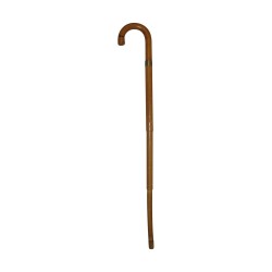 Canne ancienne en bois avec parapluie à l'intérieur.
