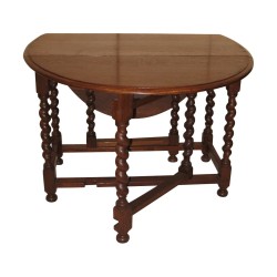 Louis XIII style oak table with drop leaves. 20th century period