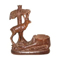 Deer near the carved wooden well. Period 19th century.