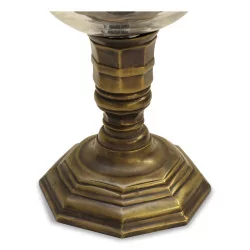 Pair of aged bronze candle holders with glass.