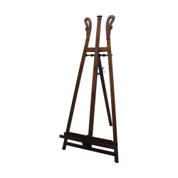 Large walnut-colored “swan” painter’s easel.