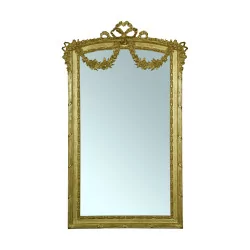 Louis XVI style rectangular mirror in gilded wood.
