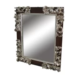 walnut mirror with silver carved wooden border.