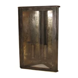 Corner lantern with 2 lights in oxidized patinated metal.