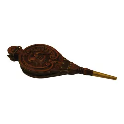 carved wooden bellows with mask.