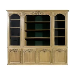 Large \"Pozzoli\" bookcase in carved and patinated oak with