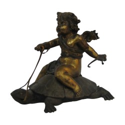 Bronze patiné avec sujet  “Angelot assis sur une …