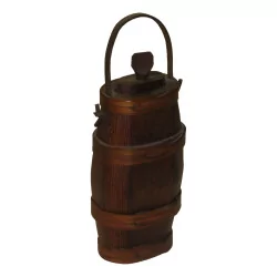 Small oval wooden liquor barrel with a leather strap.