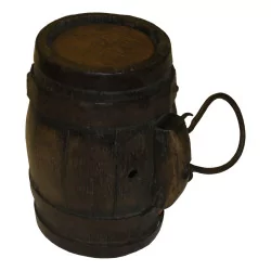 Small wooden liquor barrel with a metal handle. Era …