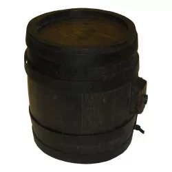Small liquor barrel in dark wood, metal strapping and …