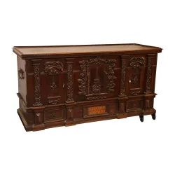 Large chest, richly carved in walnut with door on …