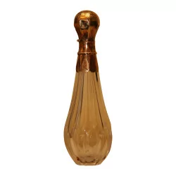 Glass perfume bottle with golden exterior cap …
