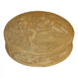 Round ivory box carved with a gallant scene on one side...
