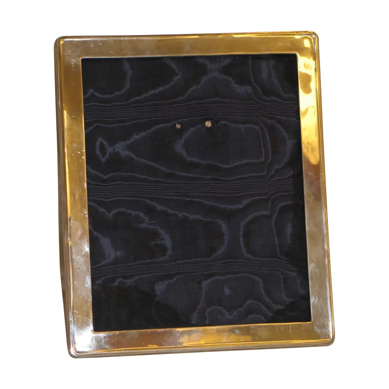 Silberner Fotorahmen (Markenzeichen) auf einem Holzrahmen … - Moinat - Bildrahmen
