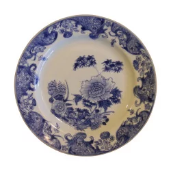 Porcelain plate with blue design and white background. …