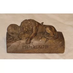 Lion of Lucerne in carved wood. Period: 20th century