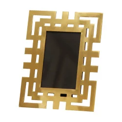 Small format “Labirinto” photo frame with gold frame.